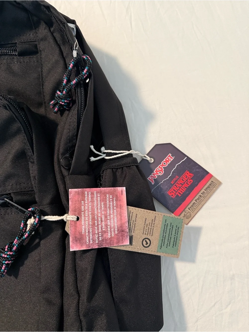 Jansport Black Backpack with Brown Base and Red Logo